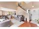 Inviting living room with hardwood floors and an open floor plan with stairs at 3780 S Quemoy Way, Aurora, CO 80018