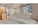 Open-concept dining room filled with natural light from large windows and adjacent to the kitchen at 2210 S Vaughn Way # 103, Aurora, CO 80014
