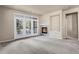 Bright living room features a cozy fireplace and access to an outdoor patio, good light at 2210 S Vaughn Way # 103, Aurora, CO 80014