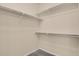 Bright walk-in closet with shelving and carpeting, perfect for organizing your wardrobe at 2210 S Vaughn Way # 103, Aurora, CO 80014