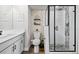Stylish bathroom with modern vanity, toilet, and glass-enclosed shower with decorative tiling at 11350 W Grand Ave, Littleton, CO 80127