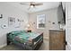 Inviting bedroom with natural light, playful decor, and comfortable furnishings at 11350 W Grand Ave, Littleton, CO 80127