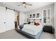 Comfortable main bedroom with ceiling fan and en suite access at 11350 W Grand Ave, Littleton, CO 80127
