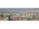 Panoramic view showcases the neighborhood with lush greenery and distant mountains at 11350 W Grand Ave, Littleton, CO 80127