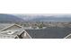 Scenic view over the neighborhood featuring rooftops, trees, and distant mountains at 11350 W Grand Ave, Littleton, CO 80127