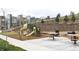 Neighborhood playground with modern play equipment, picnic tables, and barbecue grill at 11350 W Grand Ave, Littleton, CO 80127