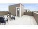 Spacious rooftop deck provides an ideal outdoor living space with comfortable chairs and city views at 11350 W Grand Ave, Littleton, CO 80127