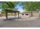Relaxing backyard featuring a gazebo, stepping stone path, and landscaping at 3064 S Grape Way, Denver, CO 80222
