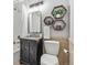 Stylish bathroom with modern fixtures, granite countertop, and decorative wall shelves at 3064 S Grape Way, Denver, CO 80222