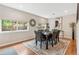 This dining room features a modern rug and large windows at 3064 S Grape Way, Denver, CO 80222
