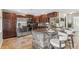 Well-equipped kitchen with stainless steel appliances and stone counter at 3064 S Grape Way, Denver, CO 80222
