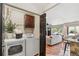 This laundry room is adjacent to the kitchen and boasts a modern washer and dryer at 3064 S Grape Way, Denver, CO 80222