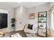 This cozy office features warm carpet, natural light, and simple furnishings at 3064 S Grape Way, Denver, CO 80222