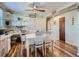 Dining area with white table and chairs and adjacent home office space at 268 Belford Dr, Northglenn, CO 80260