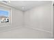 Simple bedroom with carpeted floor and a large window at 8920 Springsong Ln, Littleton, CO 80125