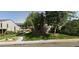 Landscaped condo building with mature trees, a walkway and a grassy lawn at 3548 S Hillcrest Dr # 2, Denver, CO 80237