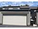 Attached one car garage with solar panels on roof and side entry door at 3548 S Hillcrest Dr # 2, Denver, CO 80237