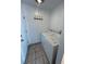 Functional laundry area with washer, dryer, tile floor, and storage potential at 3548 S Hillcrest Dr # 2, Denver, CO 80237
