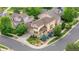 Charming home with a well-maintained yard, lush landscaping, and mature trees visible from this high definition aerial view at 20964 E Greenwood Pl, Aurora, CO 80013