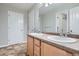 Bright bathroom featuring a double sink vanity and a large mirror at 20964 E Greenwood Pl, Aurora, CO 80013