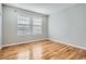 Bright, empty bedroom with neutral paint and hardwood floors at 20964 E Greenwood Pl, Aurora, CO 80013