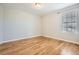 Bright, empty bedroom with neutral paint and hardwood floors at 20964 E Greenwood Pl, Aurora, CO 80013