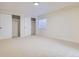 Spacious bedroom with carpet flooring, closet, and a window at 20964 E Greenwood Pl, Aurora, CO 80013