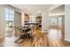 Bright dining room with hardwood floors adjacent to an eat-in kitchen with breakfast nook at 20964 E Greenwood Pl, Aurora, CO 80013