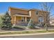 Inviting two-story home with a covered porch and manicured landscaping, creating an appealing curb appeal at 20964 E Greenwood Pl, Aurora, CO 80013