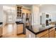 Kitchen featuring stainless steel appliances, granite countertops, a center island, and hardwood floors at 20964 E Greenwood Pl, Aurora, CO 80013