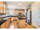 Kitchen featuring stainless steel appliances, granite countertops, a center island, and hardwood floors at 20964 E Greenwood Pl, Aurora, CO 80013