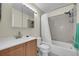 Cozy bathroom includes a shower-tub combination, a vanity with storage, and a mirrored medicine cabinet at 14110 E Dickinson Dr # A, Aurora, CO 80014