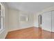 Bedroom with wood floors, large window for natural light, and double-door closet at 14110 E Dickinson Dr # A, Aurora, CO 80014