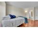 Bedroom featuring wood floors, window, and access to an ensuite bathroom at 14110 E Dickinson Dr # A, Aurora, CO 80014