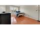 Bright bedroom features wood floors, a window, and dark furniture at 14110 E Dickinson Dr # A, Aurora, CO 80014