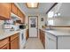 Efficient kitchen features bright cabinets and white appliances and modern lighting at 14110 E Dickinson Dr # A, Aurora, CO 80014