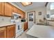 Efficient kitchen features bright cabinets and white appliances at 14110 E Dickinson Dr # A, Aurora, CO 80014
