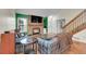 Living room with hardwood floors and brick fireplace with mounted TV at 14110 E Dickinson Dr # A, Aurora, CO 80014