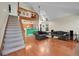 Bright living room featuring hardwood floors, vaulted ceilings and staircase to the loft at 14110 E Dickinson Dr # A, Aurora, CO 80014