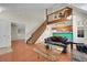 Cozy living room boasts hardwood floors, staircase, and open layout to the kitchen at 14110 E Dickinson Dr # A, Aurora, CO 80014