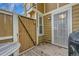 Private outdoor space includes wood deck, privacy fence, and an access gate at 14110 E Dickinson Dr # A, Aurora, CO 80014