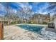 Community outdoor pool area with a safety cover, surrounded by well-maintained landscaping at 14110 E Dickinson Dr # A, Aurora, CO 80014