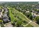 Discover this aerial shot of a community featuring greenbelts, walking paths, and beautiful homes at 16690 Amberstone Way, Parker, CO 80134