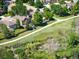 This aerial view highlights a well-maintained neighborhood with walking trails and lush green spaces at 16690 Amberstone Way, Parker, CO 80134