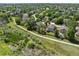 From above, discover a neighborhood with walking trails, mature trees, and well-kept homes at 16690 Amberstone Way, Parker, CO 80134