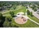 A bird's eye view of a playground, green space, and walking paths in a Gathering-friendly community at 16690 Amberstone Way, Parker, CO 80134