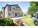 Exterior view of a home featuring a patio, new lawn, beautiful shrubbery, and exterior lighting at 16690 Amberstone Way, Parker, CO 80134
