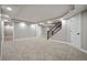 Finished basement featuring new carpet, staircase, neutral paint, and recessed lighting at 16690 Amberstone Way, Parker, CO 80134