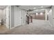 Finished basement featuring a staircase, new carpet, neutral paint, and recessed lighting at 16690 Amberstone Way, Parker, CO 80134