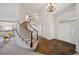 Grand foyer with curved staircase, high ceilings, and elegant chandelier, creating a welcoming entrance at 16690 Amberstone Way, Parker, CO 80134